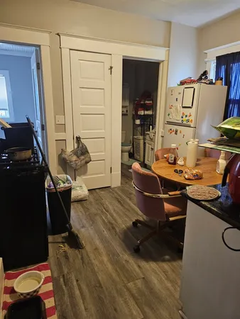 a room with furniture and wooden floor