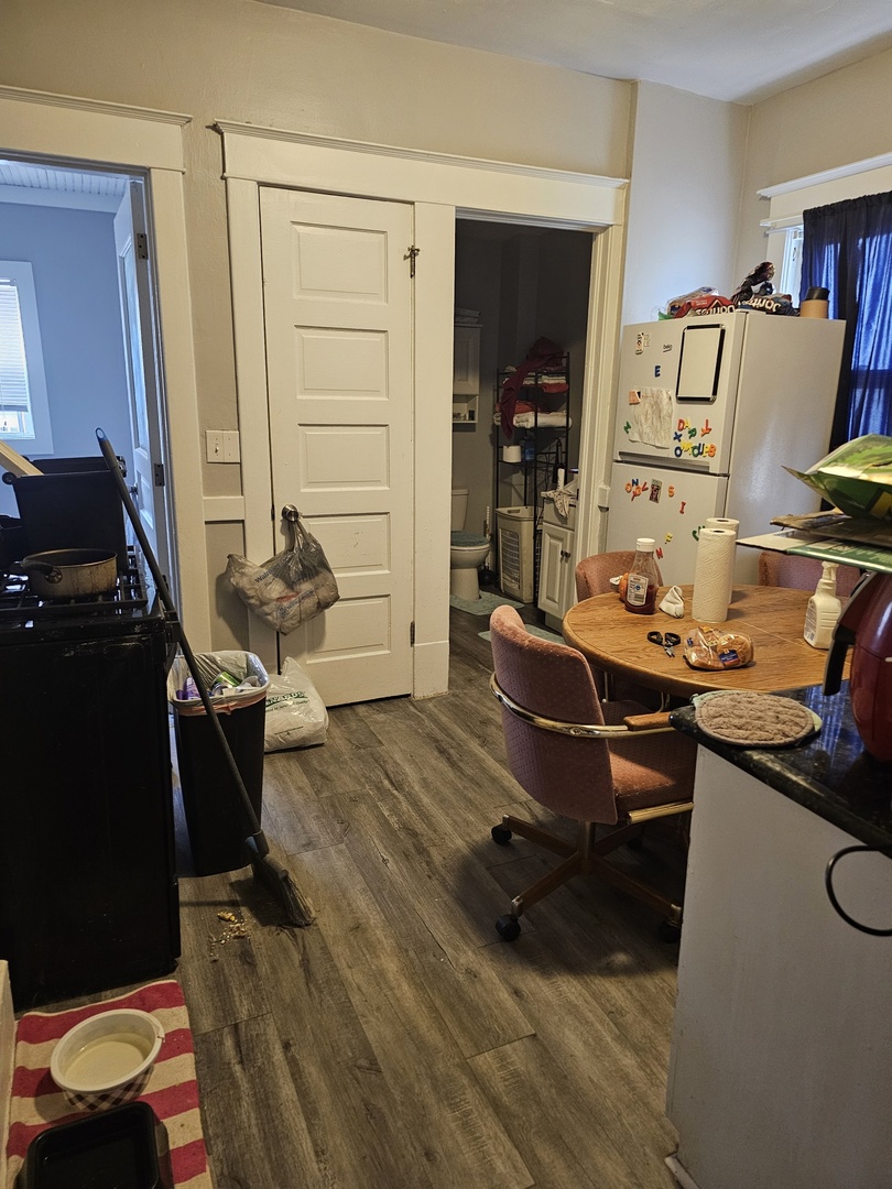 1115 14th Street Moline, IL 61265 - Photo 4 of 14 a room with furniture and wooden floor
