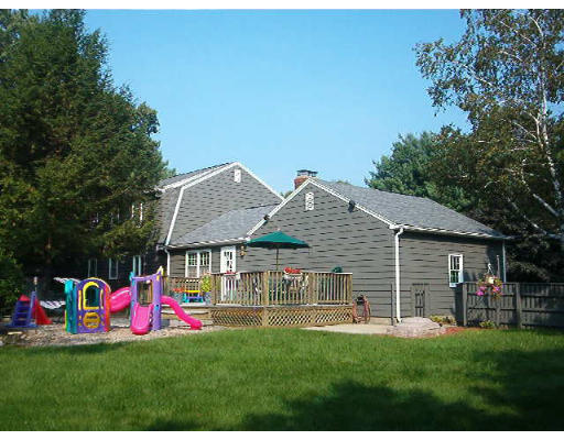 30 Blacksmith Road Wilbraham, MA 01095 - Photo 2 of 7 a house view with a sitting space and garden