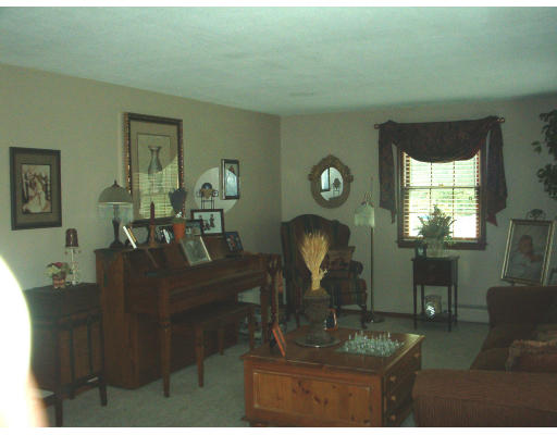 30 Blacksmith Road Wilbraham, MA 01095 - Photo 6 of 7 a living room with furniture a window and dining table
