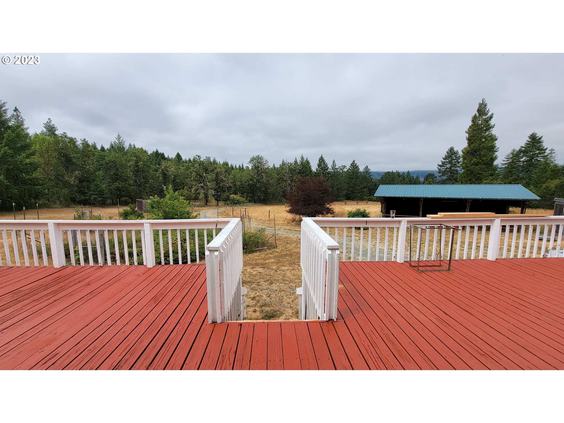 208 Buck Springs Road Camas Valley, OR 97416 - Photo 18 of 22 a balcony with wooden floor and city view