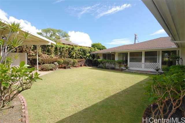 2222 Manoa Road Honolulu, HI 96822 - Photo 1 of 1 a view of a house with swimming pool patio and glass of water