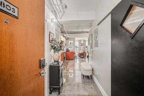 a bathroom with a toilet and a shower curtain