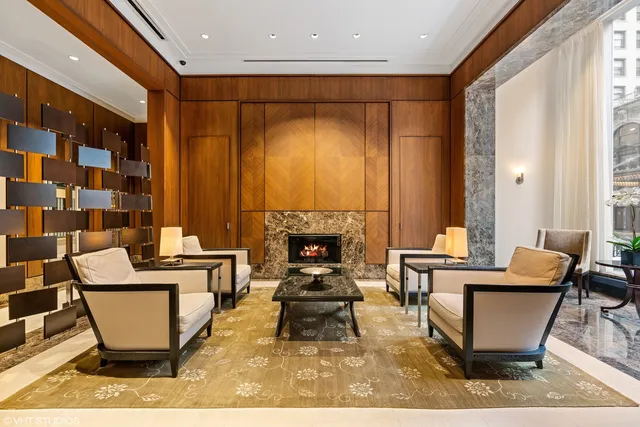 a living room with a couch and a fireplace