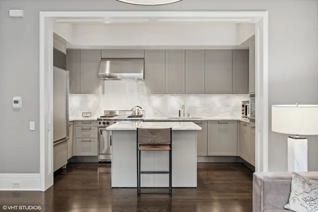 a kitchen with a sink cabinets and window