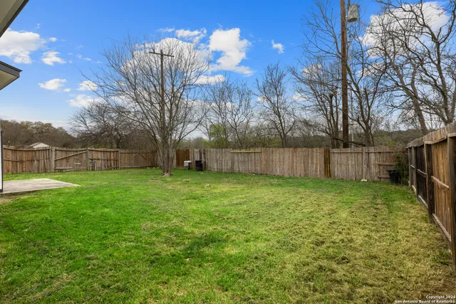 a view of a backyard with green space