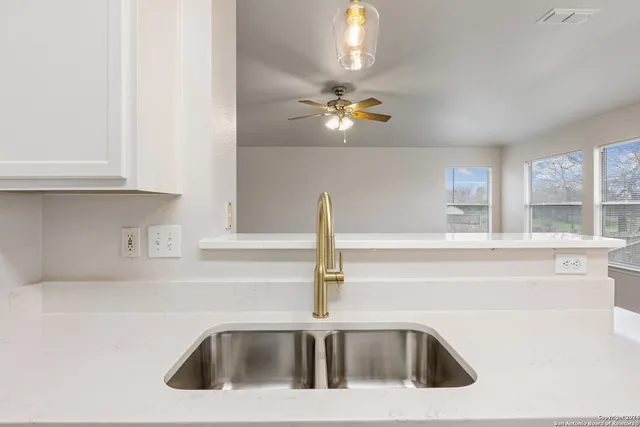 a kitchen with a sink and a window