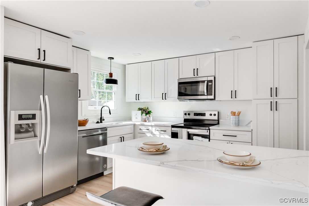 1905 Reagan Road Henrico, VA 23228 - Photo 13 of 41 Kitchen featuring pendant lighting, white cabinets