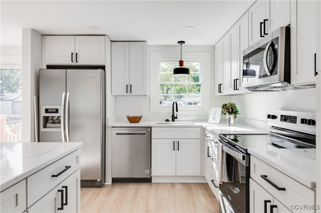 1905 Reagan Road Henrico, VA 23228 - Photo 14 of 41 Kitchen featuring white cabinets, appliances with