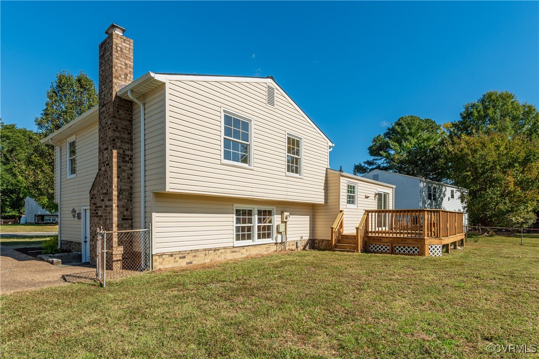 1905 Reagan Road Henrico, VA 23228 - Photo 39 of 41 Rear view of house with a deck and a lawn