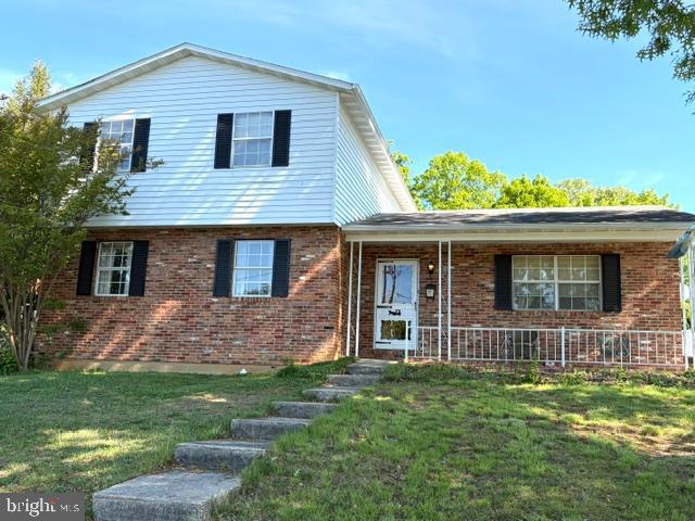 108 Kingbrook Road Linthicum Heights, MD 21090 - Photo 1 of 15 front view of a house with a yard