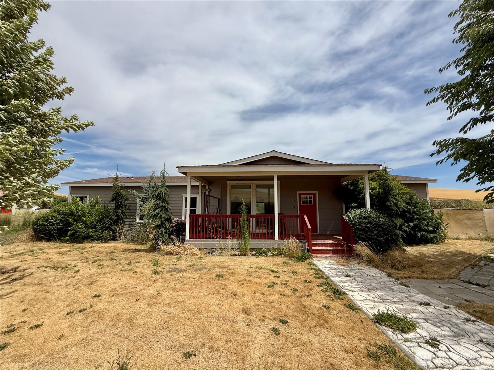 front view of a house with a yard