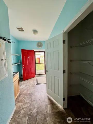 a bathroom with a granite countertop sink and a toilet