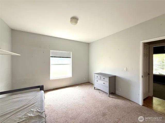 a spacious bathroom with a sink and a toilet