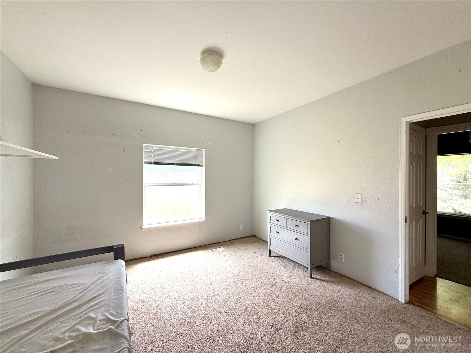 110 Main Road Dayton, WA 99328 - Photo 24 of 36 a view of an empty room with a window and a kitchen
