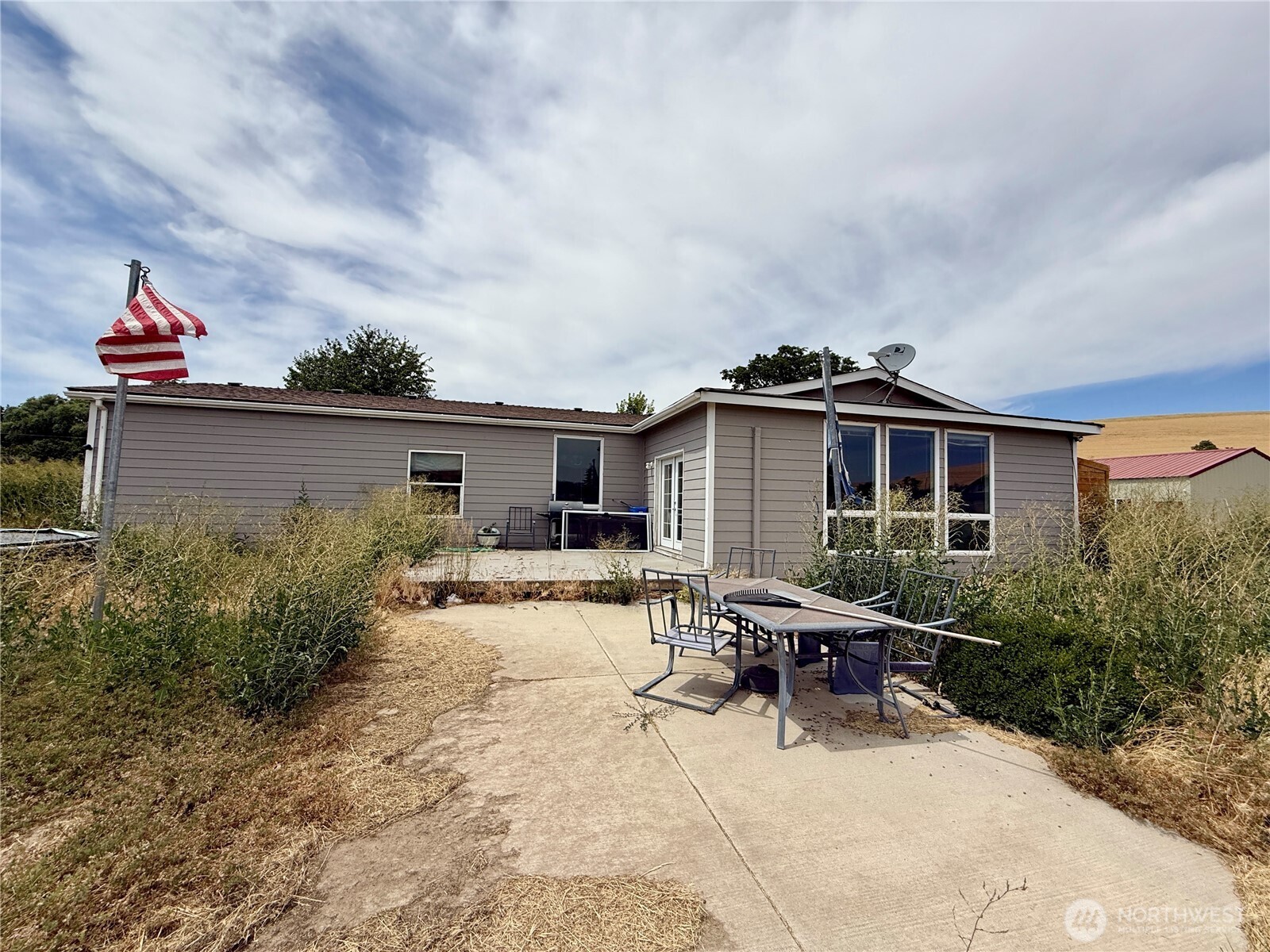 110 Main Road Dayton, WA 99328 - Photo 29 of 36 a view of a house with backyard and sitting area