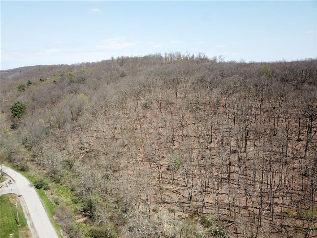 226 Kime Road Rural Valley, PA 16249 - Photo 14 of 17 a view of a dry yard with mountains in the background