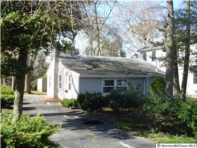 2204 Edgar Road Point Pleasant, NJ 08742 - Photo 1 of 2 a view of a house with a yard plants and large tree