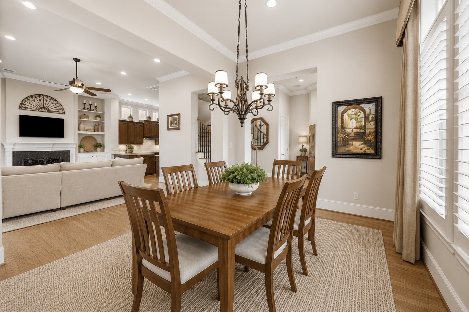 907 Queen Annes Road Houston, TX 77024 - Photo 7 of 31 Formal dining room seamlessly connected to the living and kitchen areas, creating an ideal layout for both everyday living and entertaining. This image has been virtually staged for illustrative purposes.