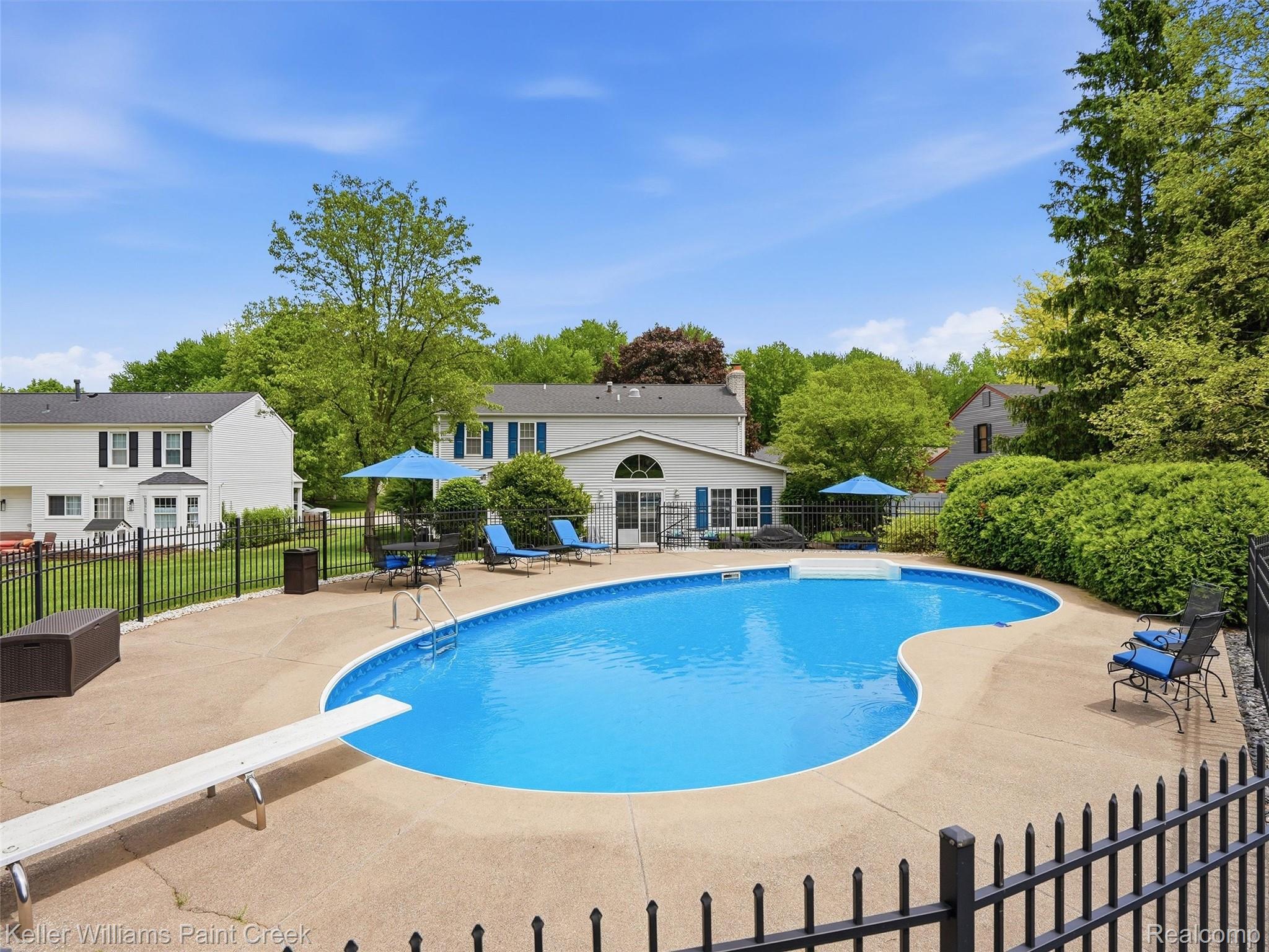 1351 West Fairview Lane Rochester, MI 48306 - Photo 5 of 65 View of pool with patio surround and a diving board
