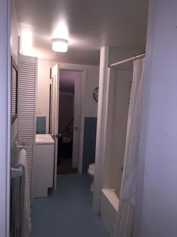 a bathroom with a bathtub and a sink