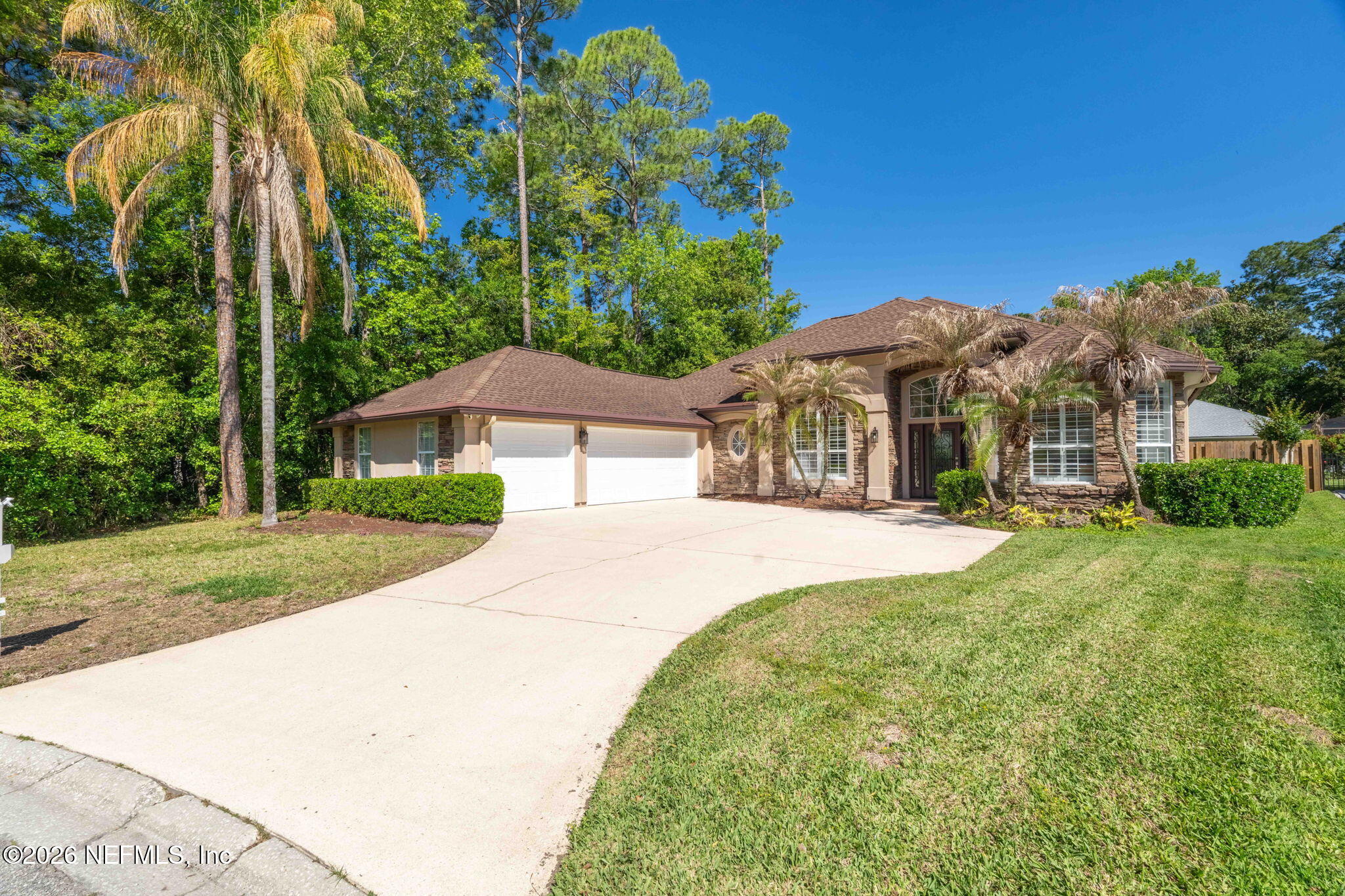 1600 Spring Water Court Fleming Island, FL 32003 - Photo 5 of 85 a front view of a house with a yard and trees