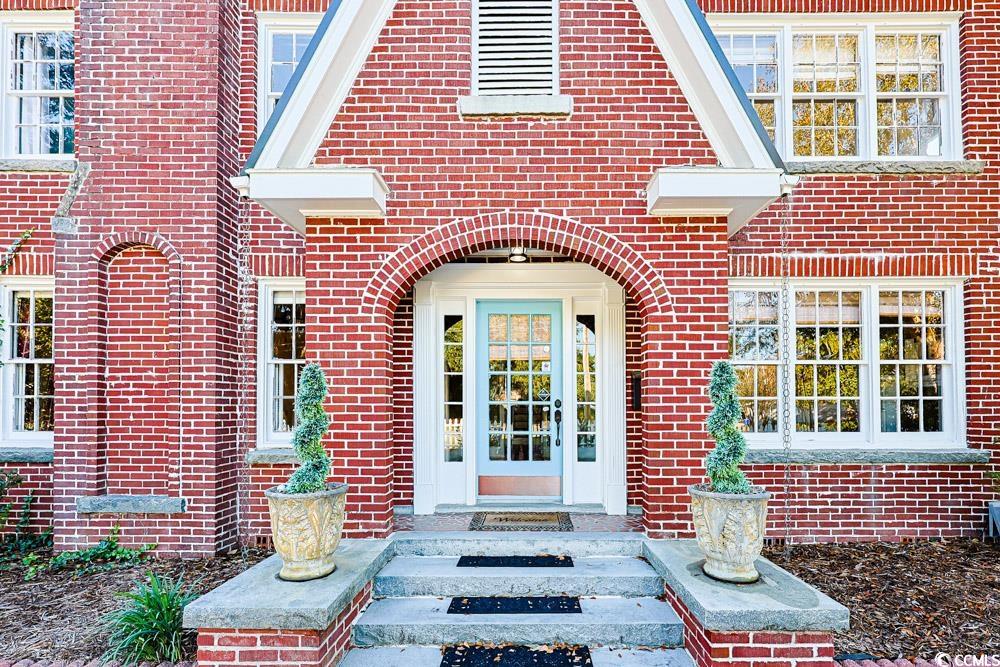 509 Beaty Street Conway, SC 29526 - Photo 37 of 40 Doorway to property with brick siding