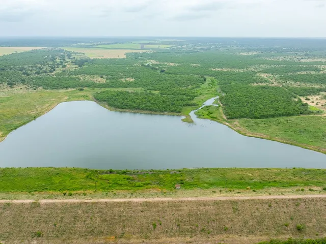 an aerial view of a house with a garden