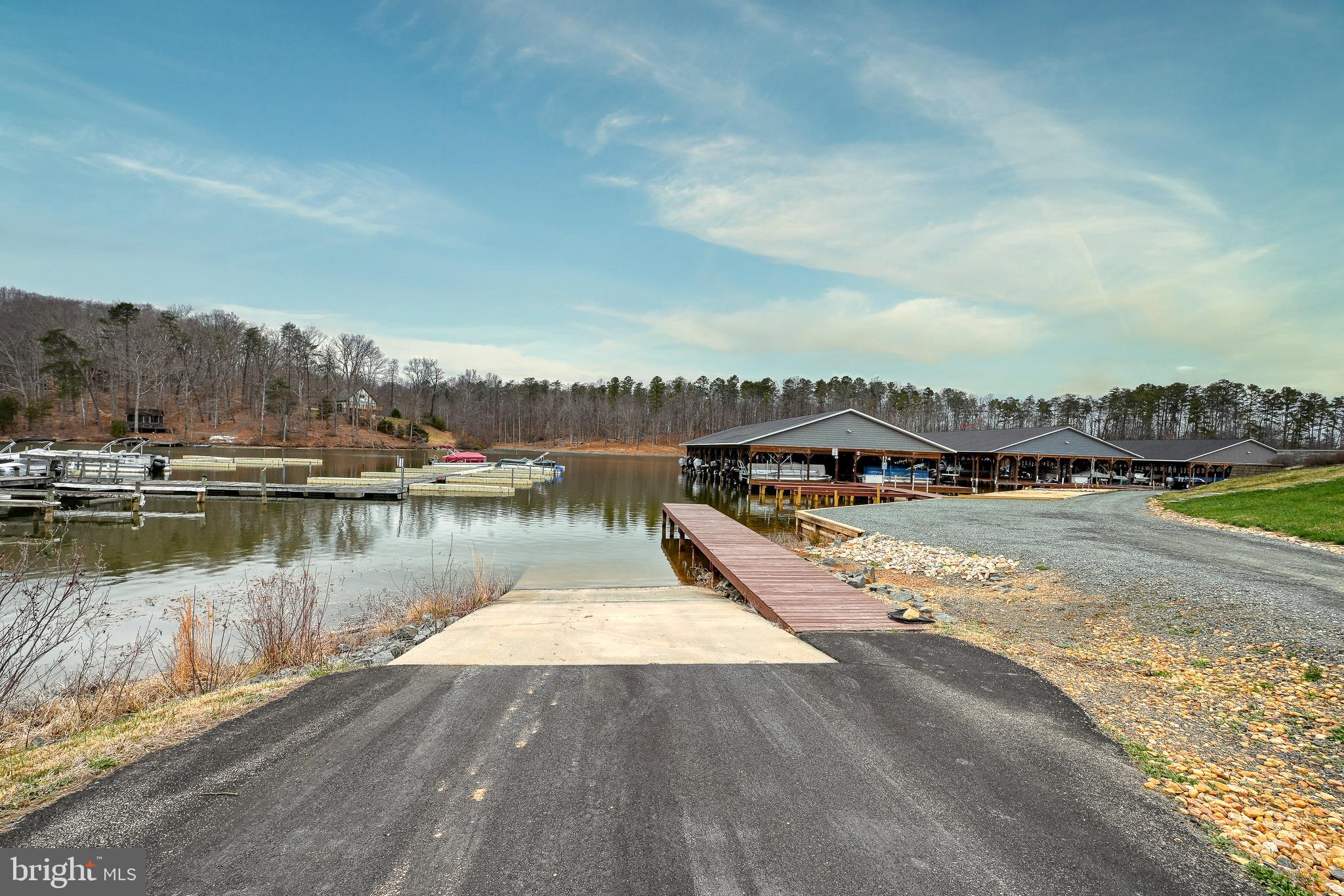 287 Sunset Loop Mineral, VA 23117 - Photo 10 of 112 a view of a lake with houses in the back