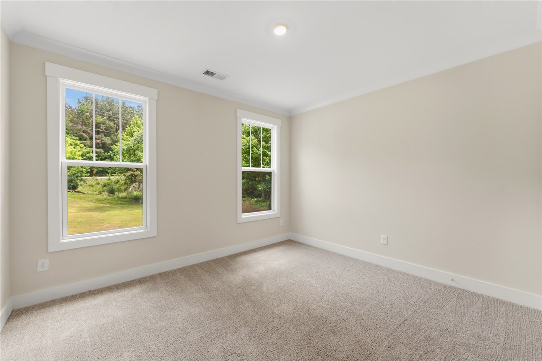 203 Timothy Court Anderson, SC 29621 - Photo 39 of 40 Two well-placed windows naturally illuminate this spacious, unfurnished room.