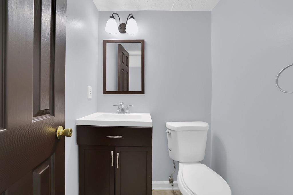 1424 Springleaf Circle Southeast Smyrna, GA 30080 - Photo 20 of 38 a bathroom with a toilet sink and mirror