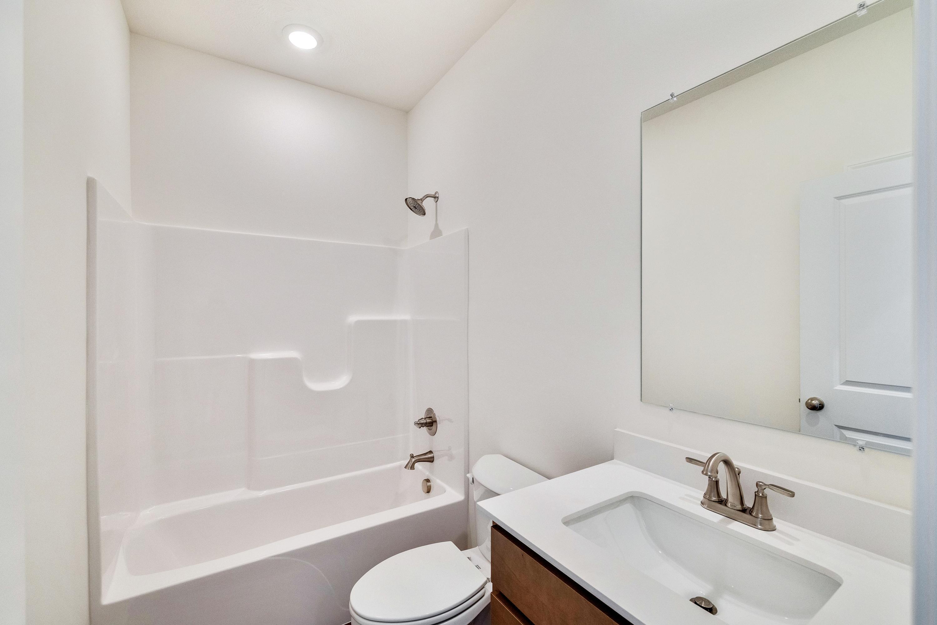 13070 Carolina Street Crown Point, IN 46307 - Photo 5 of 18 a bathroom with a sink toilet and shower