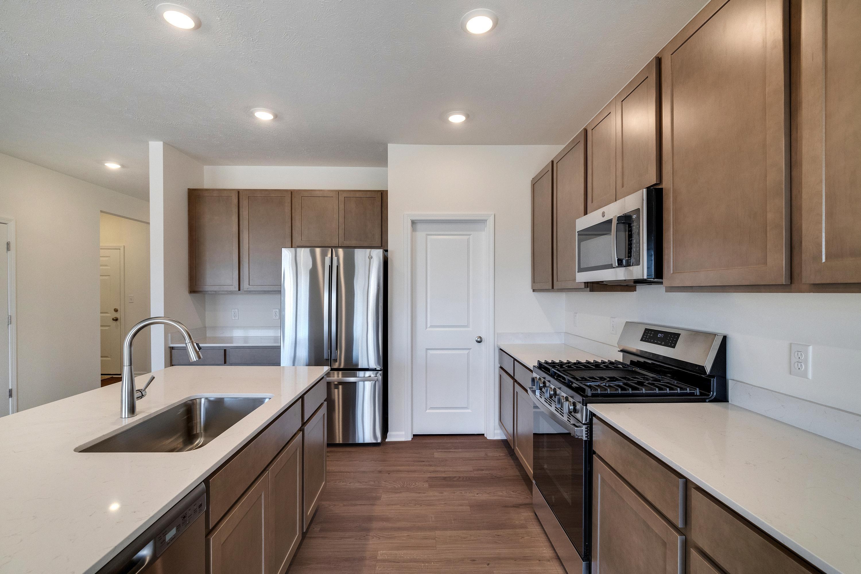 13070 Carolina Street Crown Point, IN 46307 - Photo 10 of 18 a kitchen that has a sink and a stove