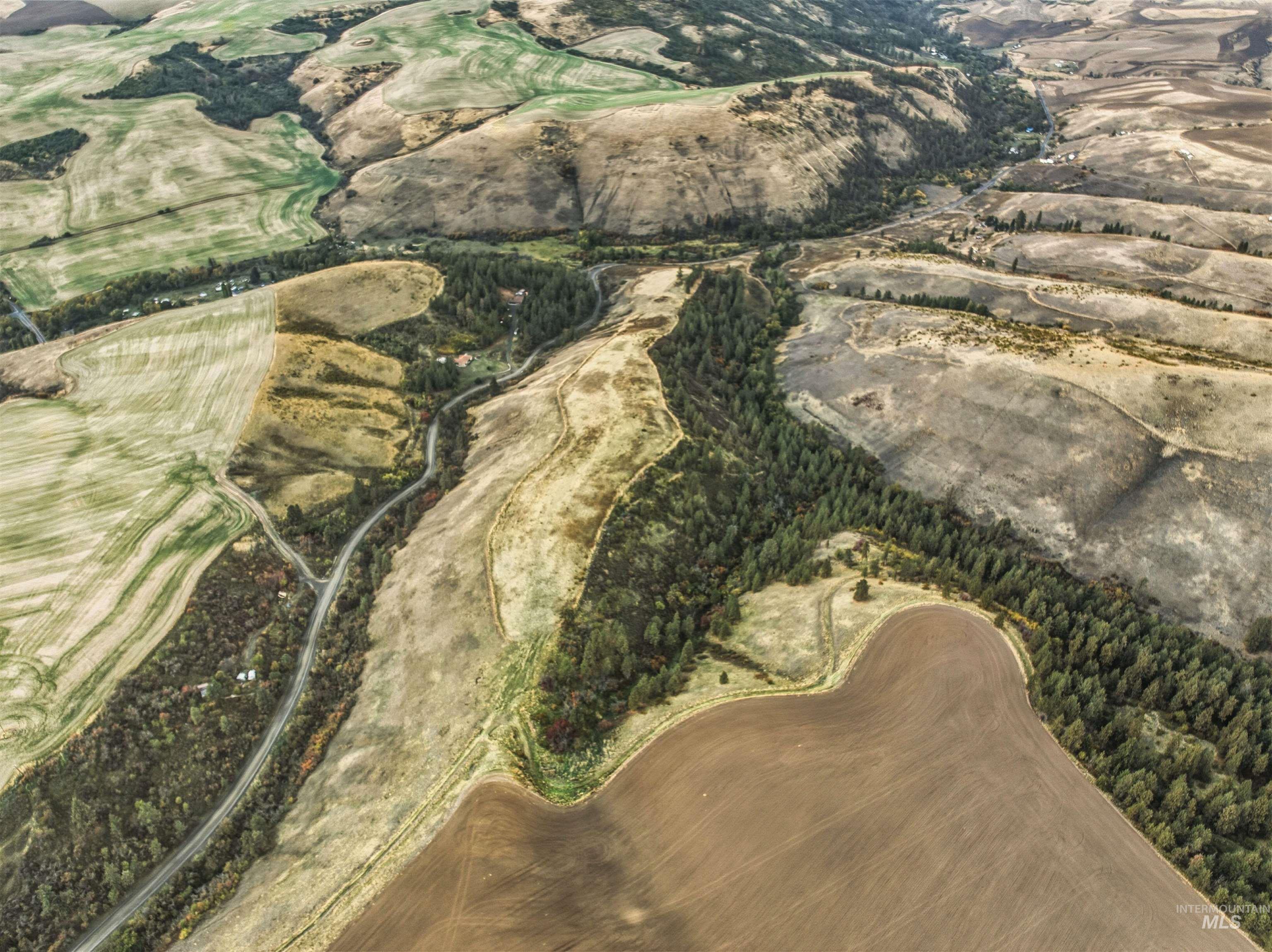 Tbd Tbd Kettenbach Grade Culdesac, ID 83524 - Photo 3 of 26 Aerial view of property's location featuring a golf course
