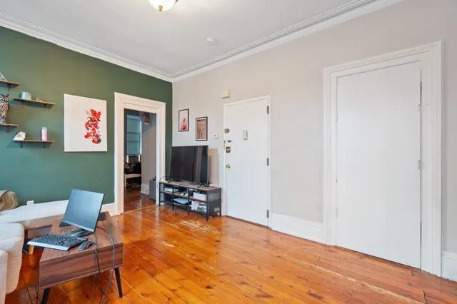 a view of a livingroom with furniture and a flat screen tv