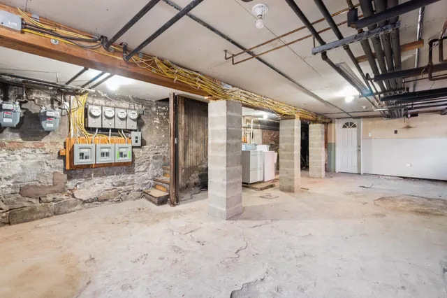 a view of a room with wooden walls