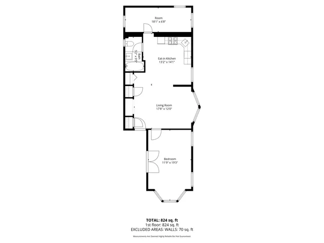 a picture of a bench in front of a wall