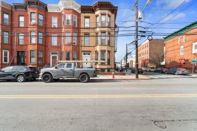 a building with a lots of cars parked in front of it