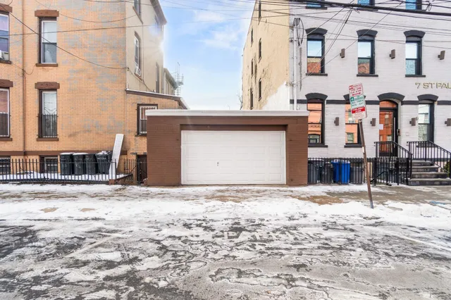 a front view of a building with a road