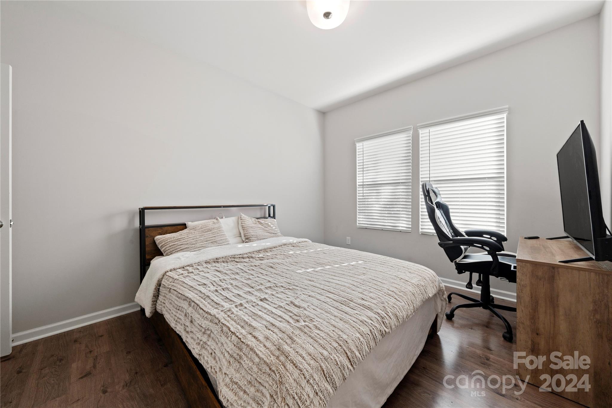 1568 Whitman Court York, SC 29745 - Photo 21 of 40 a bedroom with a bed and a flat screen tv