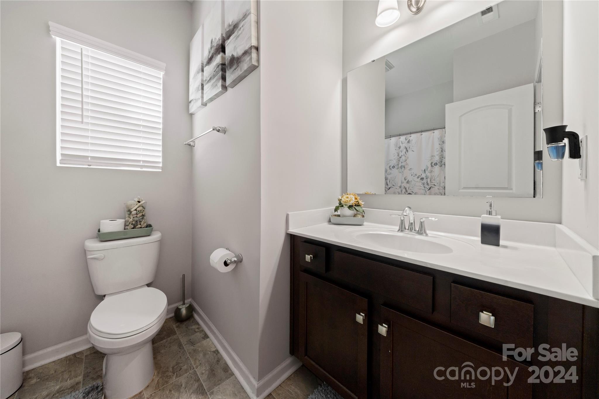 1568 Whitman Court York, SC 29745 - Photo 22 of 40 a bathroom with a toilet sink and mirror