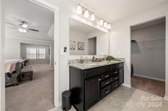 a bathroom with a sink double vanity and a mirror