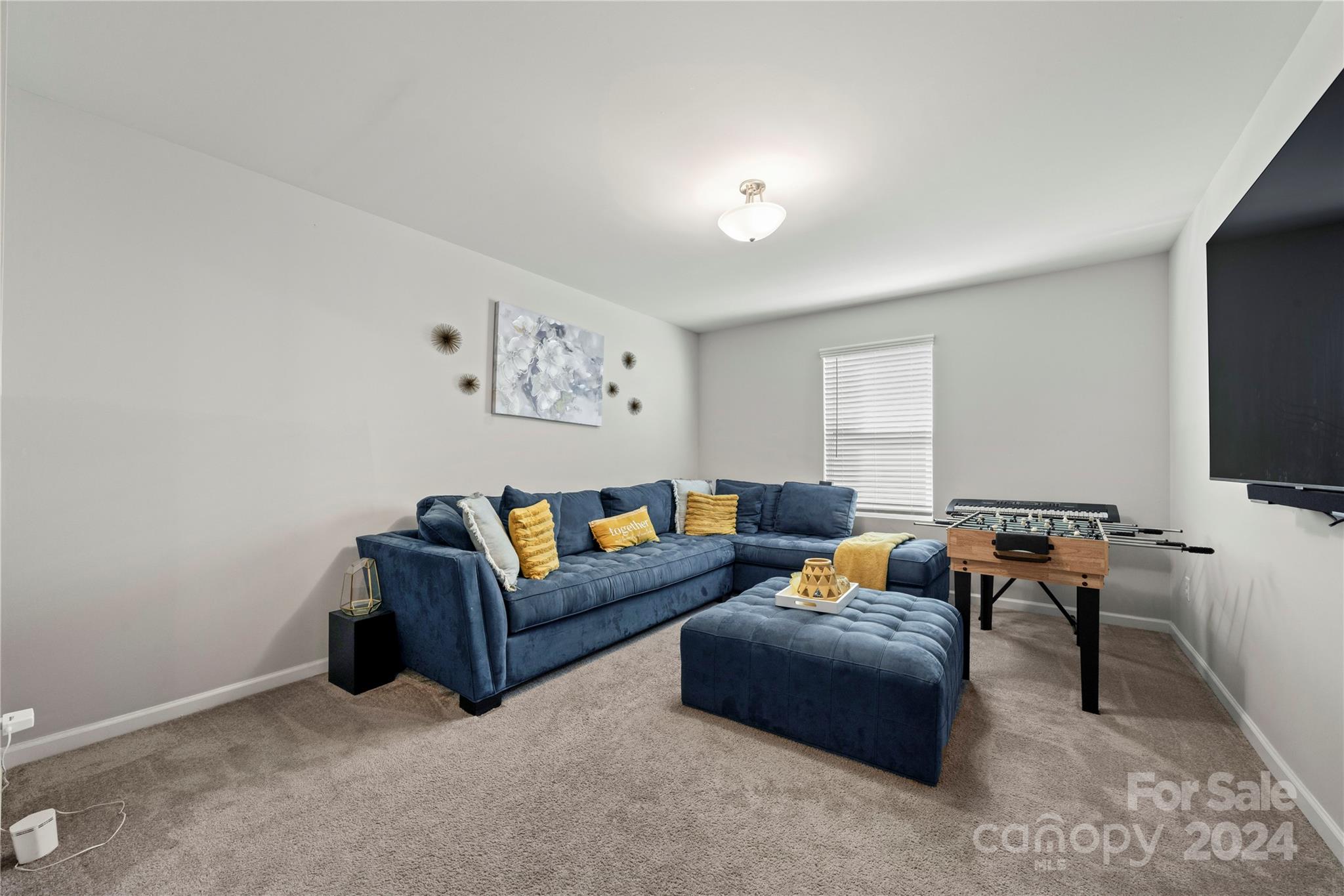 1568 Whitman Court York, SC 29745 - Photo 31 of 40 a living room with furniture a flat screen tv and a window