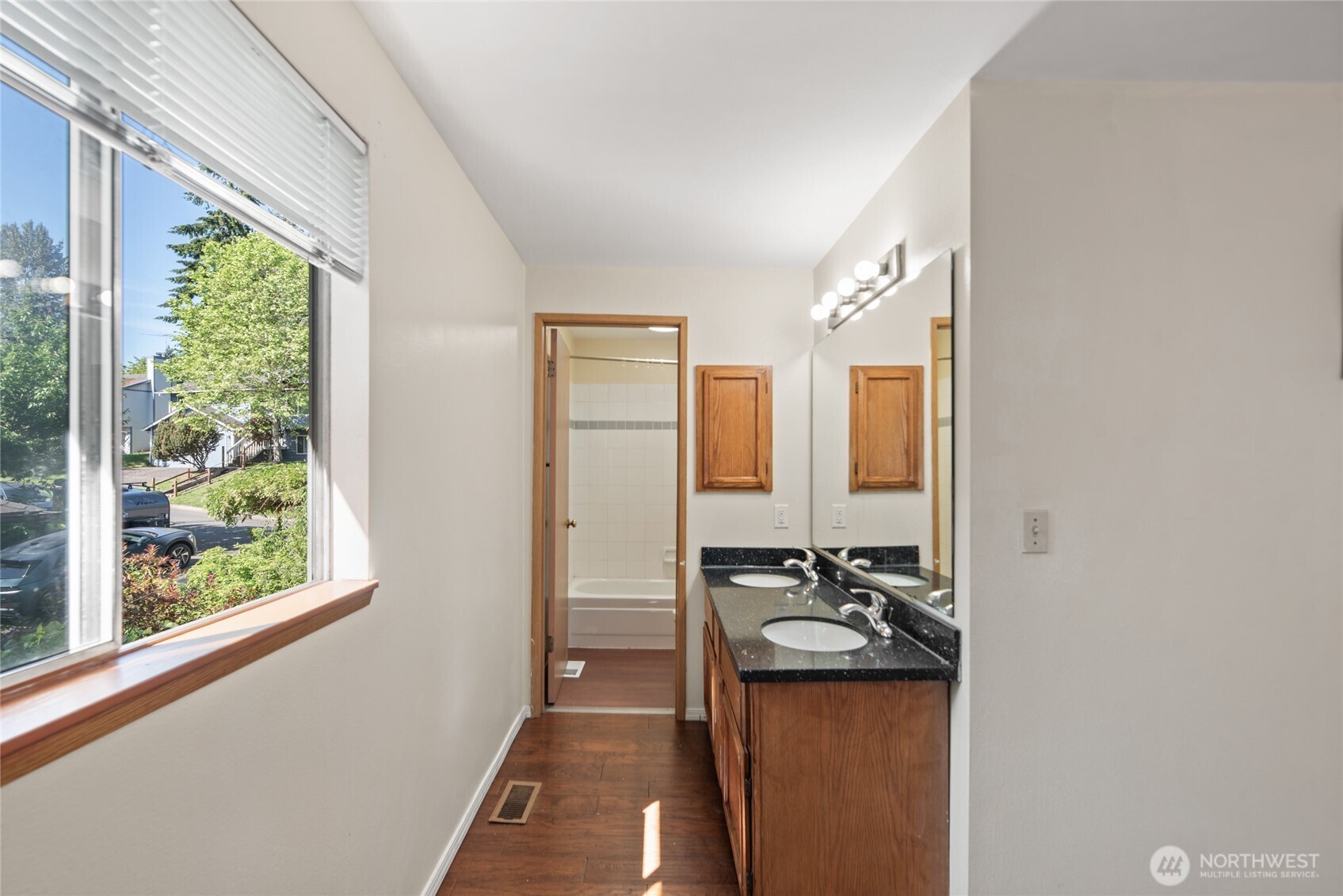 10606 68th Place South Seattle, WA 98178 - Photo 18 of 31 a bathroom with a granite countertop sink and a mirror