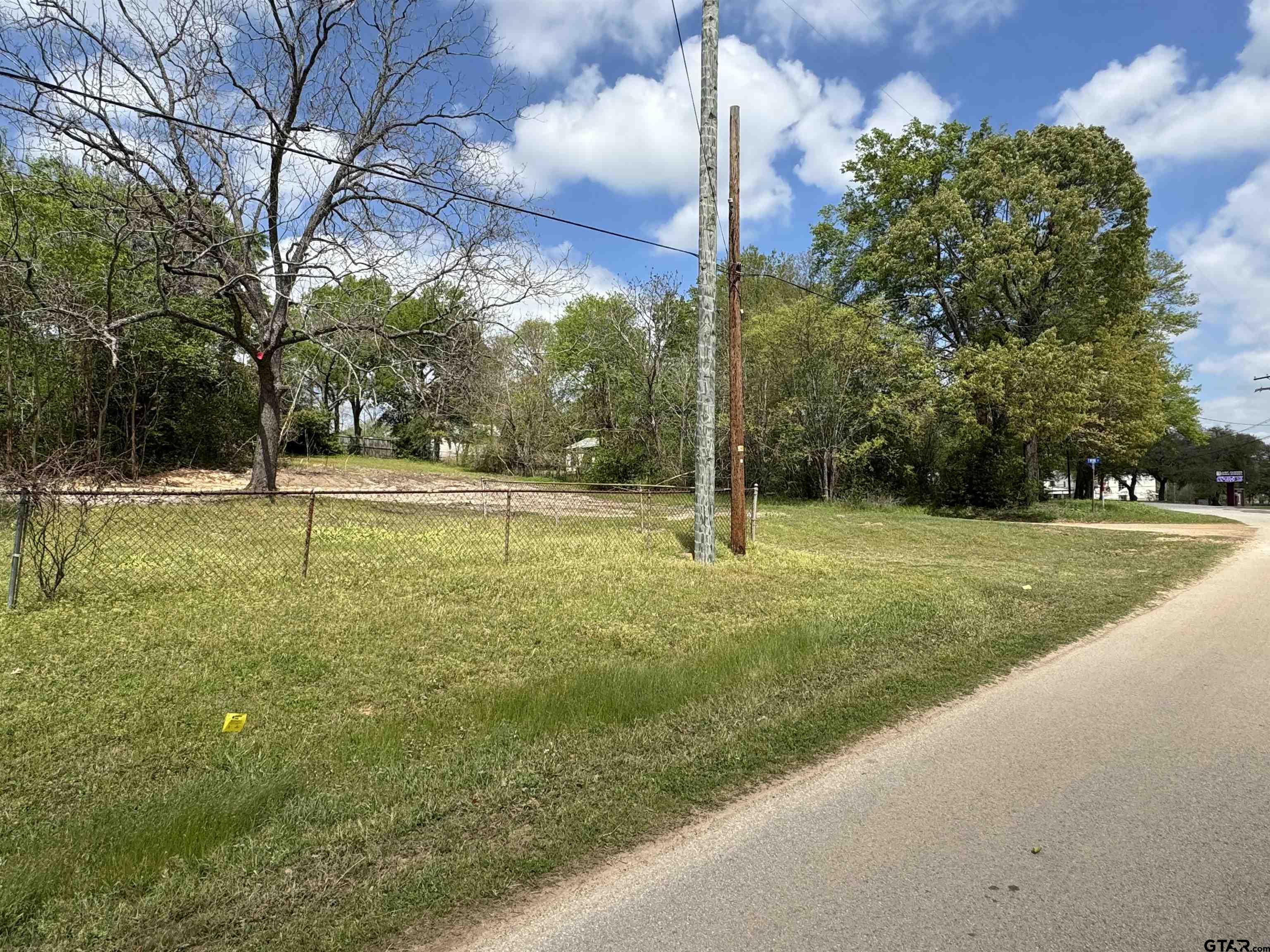 207 East Front Street Arp, TX 75750 - Photo 7 of 8 a view of a garden with a fountain