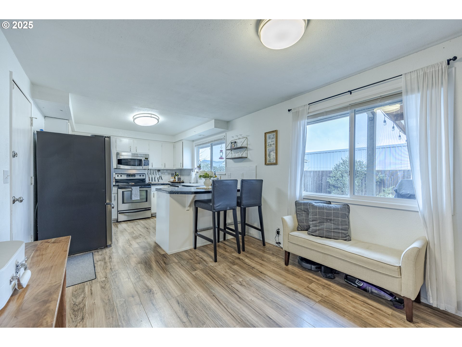 175 North 49th Street Springfield, OR 97478 - Photo 13 of 37 a open kitchen with white cabinets and stainless steel appliances