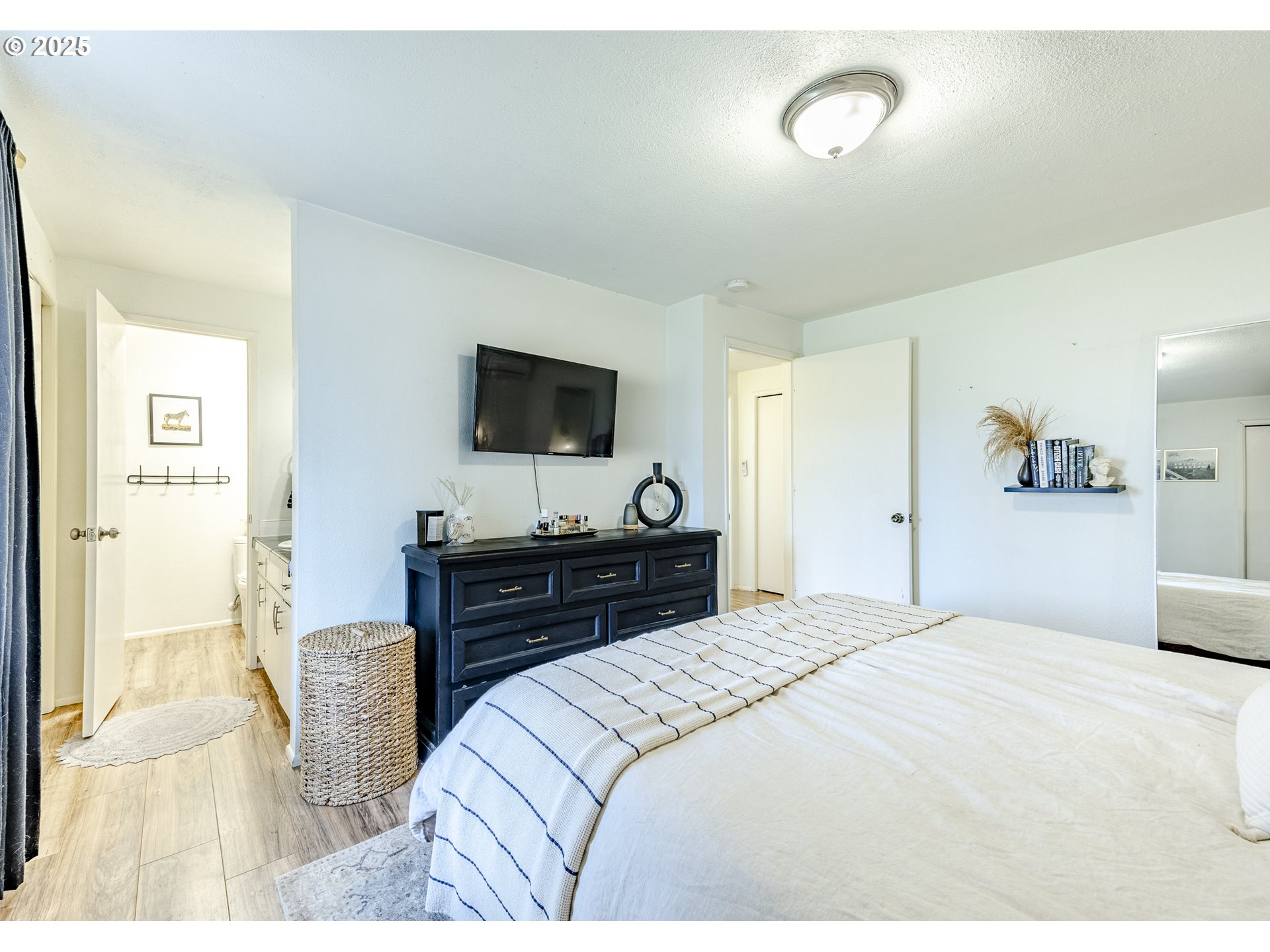 175 North 49th Street Springfield, OR 97478 - Photo 24 of 37 a bedroom with a bed and a flat screen tv