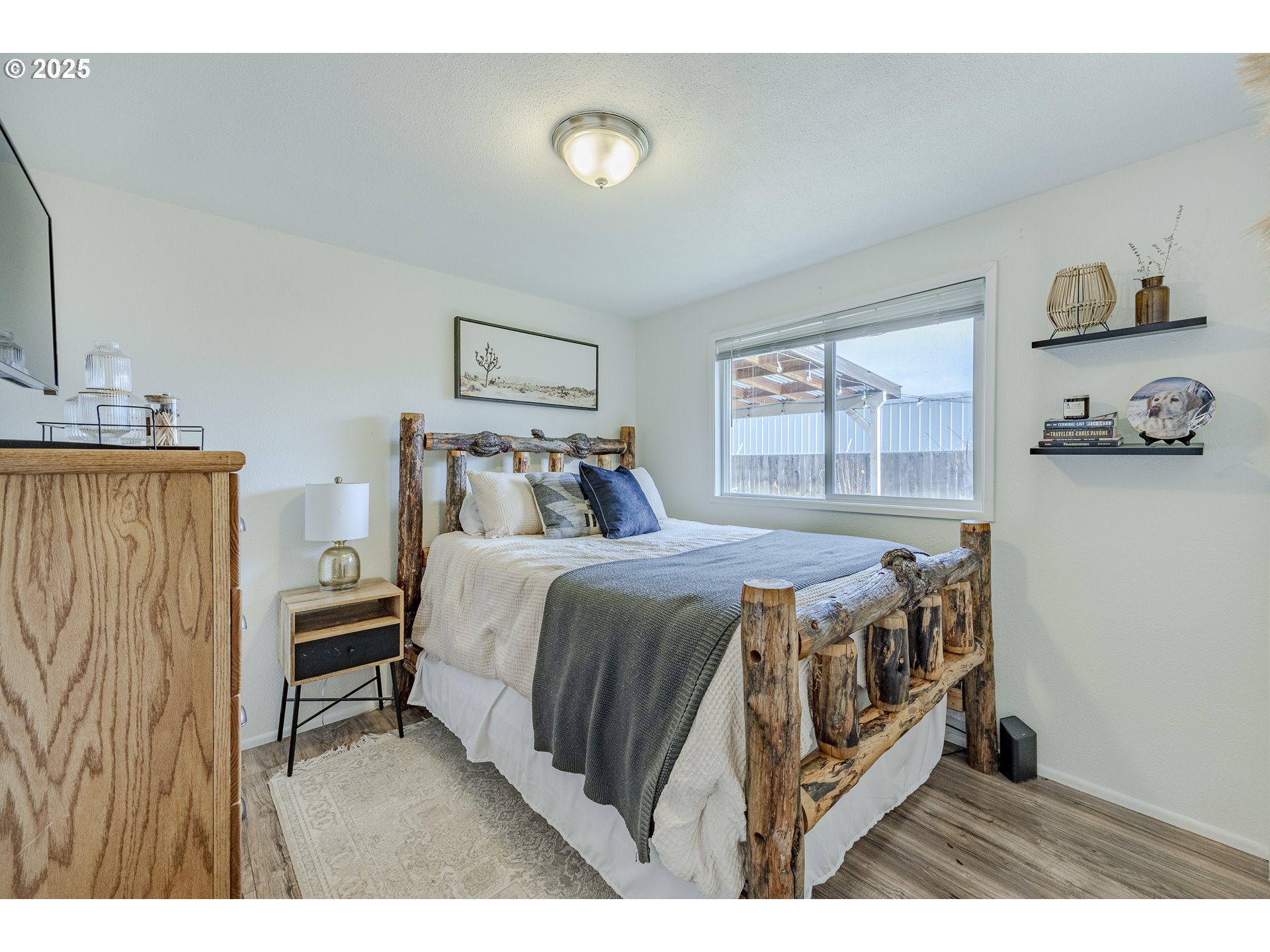 175 North 49th Street Springfield, OR 97478 - Photo 26 of 37 a bedroom with a bed a mirror and a desk