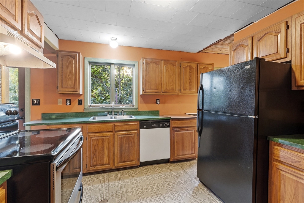 150 Brickyard Road Athol, MA 01331 - Photo 11 of 33 a kitchen with stainless steel appliances granite countertop a refrigerator a sink a stove and island