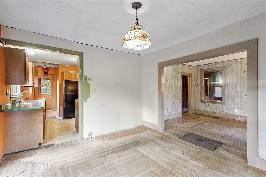 150 Brickyard Road Athol, MA 01331 - Photo 9 of 33 a view of an entryway of kitchen and dining room with chandelier